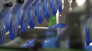 Dipping process of nitrile gloves in the manufacturing process [upl. by Pulcheria]