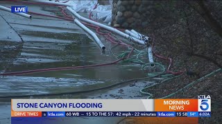 Claremont neighborhood uses sandbags hoses to divert rising groundwater thats flooding the area [upl. by Pega]