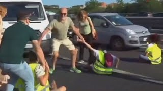 Furious drivers physically drag activists off a busy highway [upl. by Galatia]