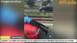 Insolite  Un agent de police trimballé sur capot dun taxi de Plateau à Treichville Abidjan [upl. by Nylarak489]