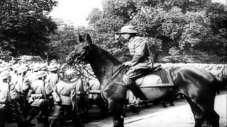 German troops decorated and troops pass in review along Avenue Foch Paris durinHD Stock Footage [upl. by Anayhd570]