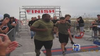 Marine honored for carrying triathlete across finish line [upl. by Assillem716]