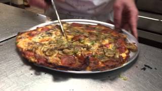 Cutting up a Fricanos EBA Pizza Pie in Michigan [upl. by Retsehc514]