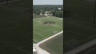 जमीन ने निगल लिया फुटबॉल का मैदान  100 foot sinkhole swallows part of soccer field in Illinois [upl. by Ientruoc]