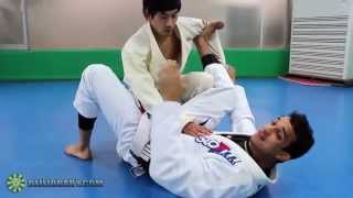 Spider Guard Scissor Sweep to Triangle with Romulo Barral BJJLIBRARYCOM [upl. by Peta]