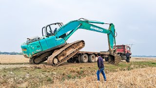 Kobelco SK210LC 210 Excavator operator loading Trailer  Excavator Loading trucks  Excavator load [upl. by Lyontine]