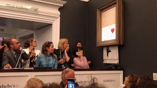 Banksy  Shredding his artwork at Sothebys live auction on October 5th 2018 October 5 2018 [upl. by Lrig]