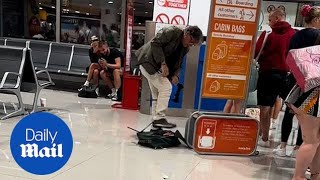 EasyJet passenger destroys his luggage to avoid excess baggage fee [upl. by Moorish833]