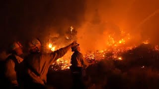 As wildfires burn in California firefighters work to contain the flames [upl. by Navad72]