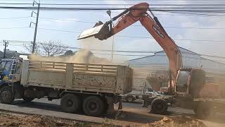 Wheeled Excavator Working On Highway [upl. by Nylecsoj736]