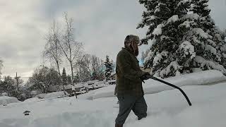 SHOVELING OUR ROOF AFTER MASSIVE SNOW STORM IN ALASKA [upl. by Landsman932]