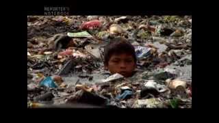 Reporters Notebook Kids wade in garbagefilled water for a living Burak at Pangarap [upl. by Sivrahc]