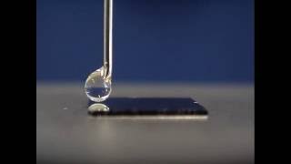 Water droplet moving across a wettability gradient [upl. by Dulsea88]