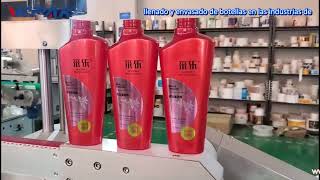 Máquina etiquetadora semiautomática de botellas ovaladas de anversoreverso [upl. by Grata]