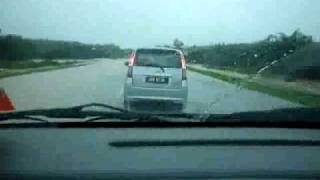 Crossing flooding road in my MPV [upl. by Ahsyekal]