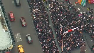 Crowds gather in Times Square for surprise from BTS member Jung Kook [upl. by Einej964]