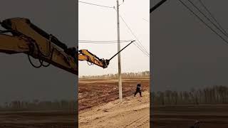 Wire laying process from ground onto a pole with an excavator [upl. by Yblocaj]