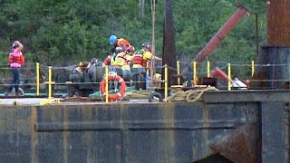 Workers jump from tugboat as it capsizes on the St Lawrence [upl. by Eartnoed]