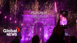 New Years 2023 Paris France gets the party started with fireworks smoke show over Arc de Triomphe [upl. by Ahras88]