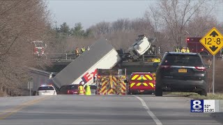 WATCH Tractortrailer hangs over bridge driver and family injured [upl. by Okire]